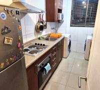 Cocina amoblada vista dos