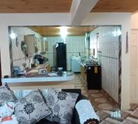 VISTA DE COCINA CON CONCEPTO ABIERTO DESDE LIVING COMEDOR