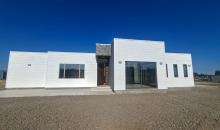 Frente de la casa, construcción tipo mediterránea